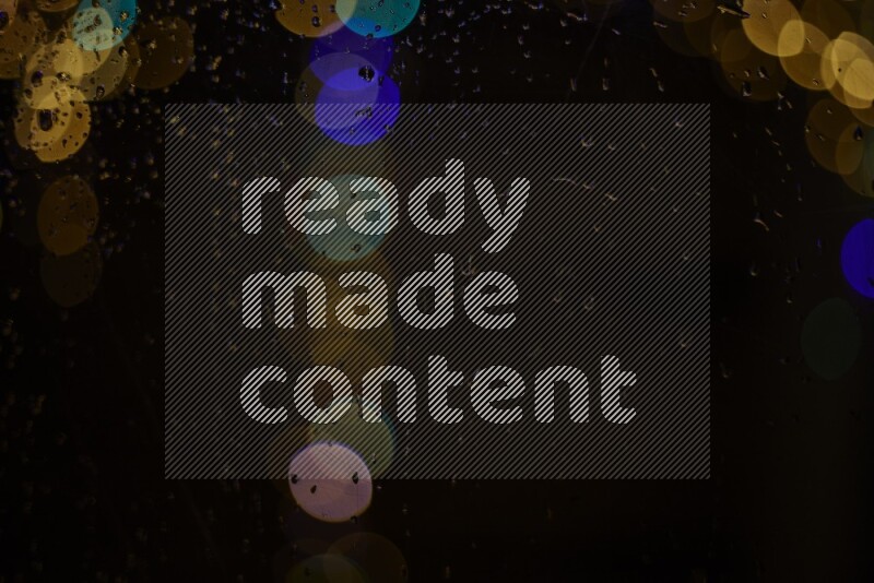 Bokeh light in multicolor with water drops