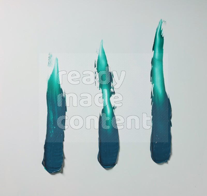 Turquoise painting knife strokes on white background