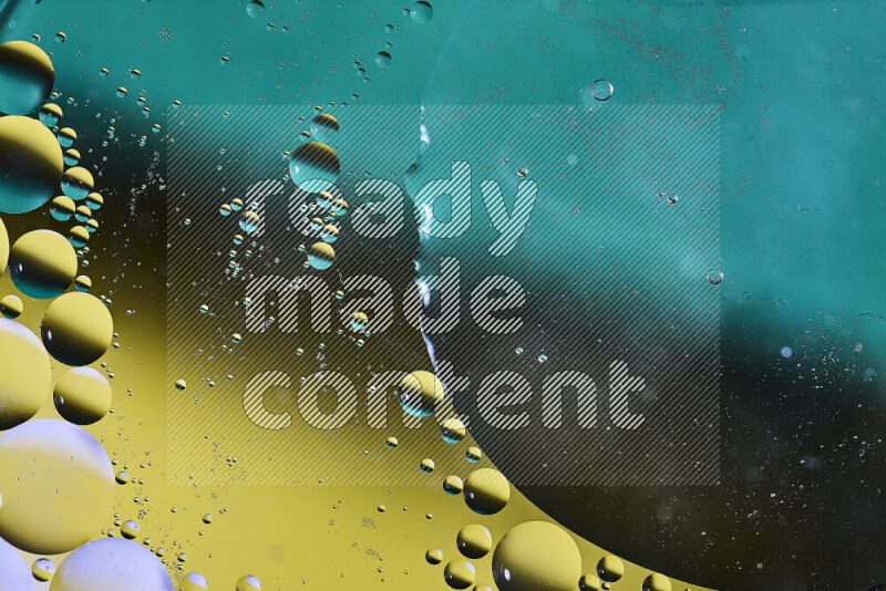 Close-ups of abstract oil bubbles on water surface in shades of green, black and yellow