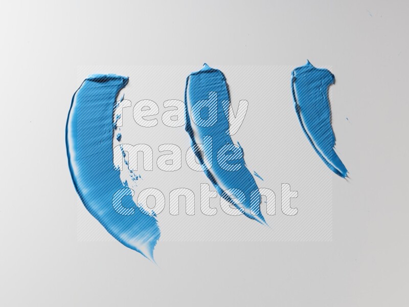 Blue painting knife strokes on white background