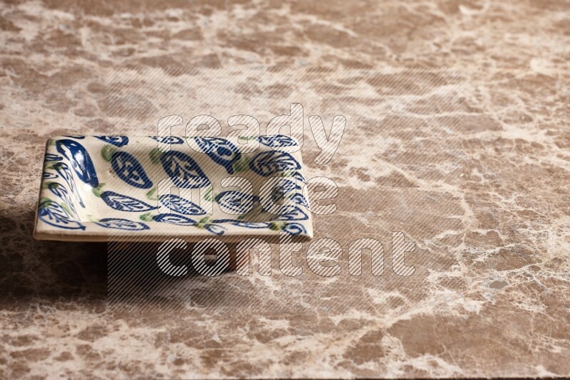 Decorative Pottery Plate on Beige Marble Flooring
