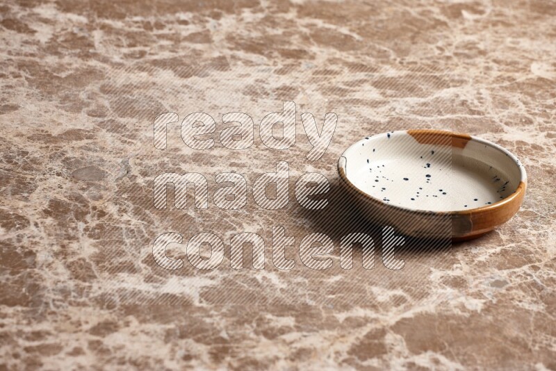 Multicolored Pottery Bowl on Beige Marble Flooring