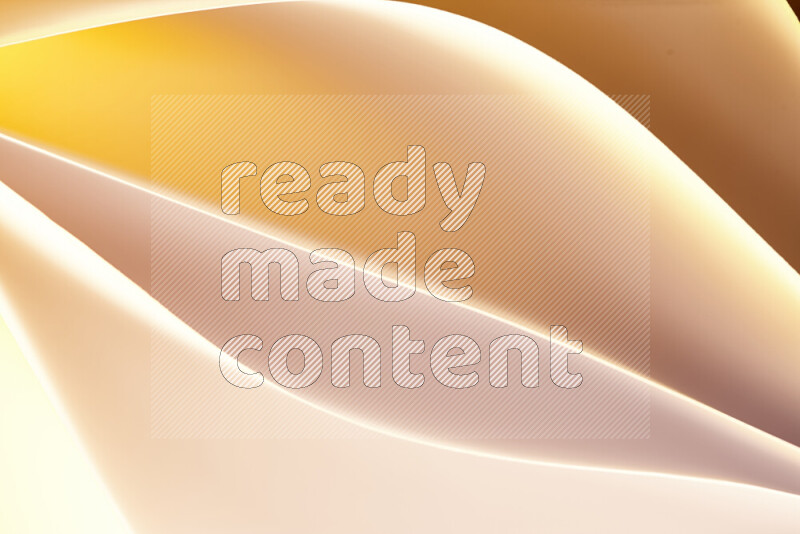 This image showcases an abstract paper art composition with paper curves in gold gradients created by colored light