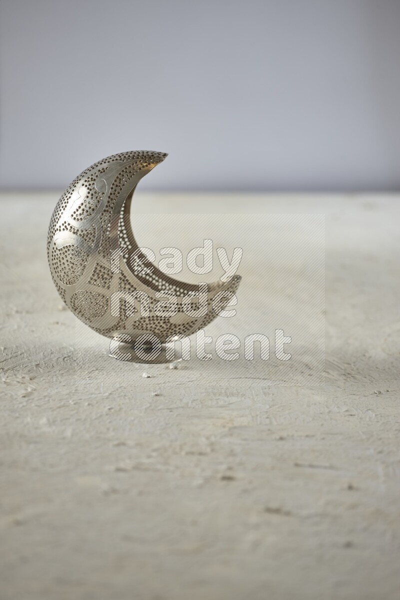 A lantern placed on a textured white background