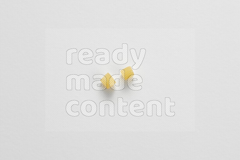 Small rings pasta on white background