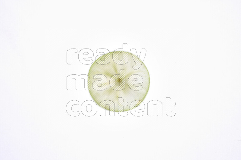 Apple slices on illuminated white background