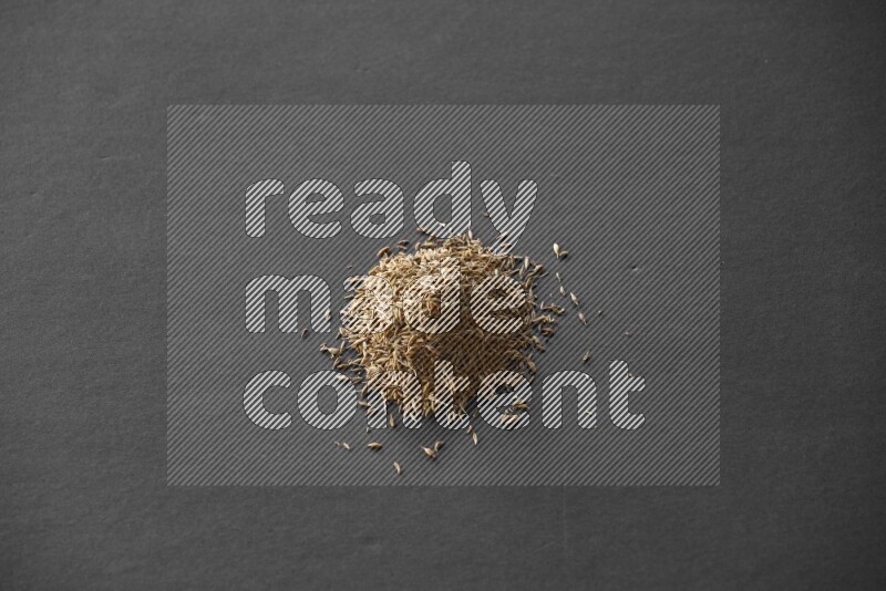 حبوب الكمون علي خلفية سوداء