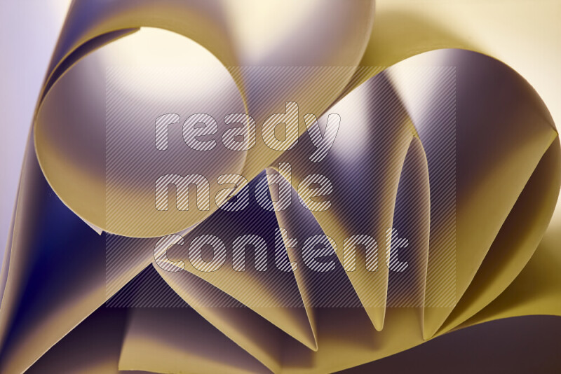 An artistic display of paper folds creating a harmonious blend of geometric shapes, highlighted by soft lighting in warm tones