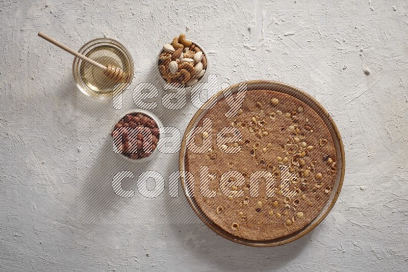 Basbousa with nuts and honey in a light setup
