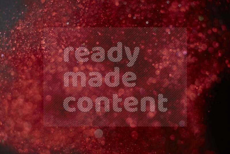 Red glitter powder isolated on black background