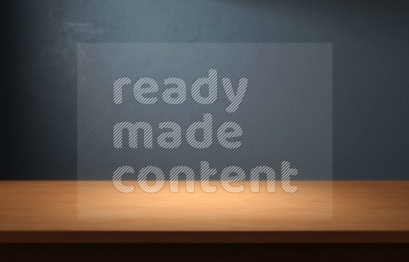 A wooden table top with colored textured wall background