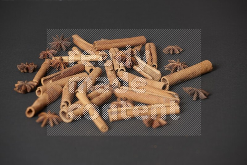 Cinnamon sticks and star anise on black background