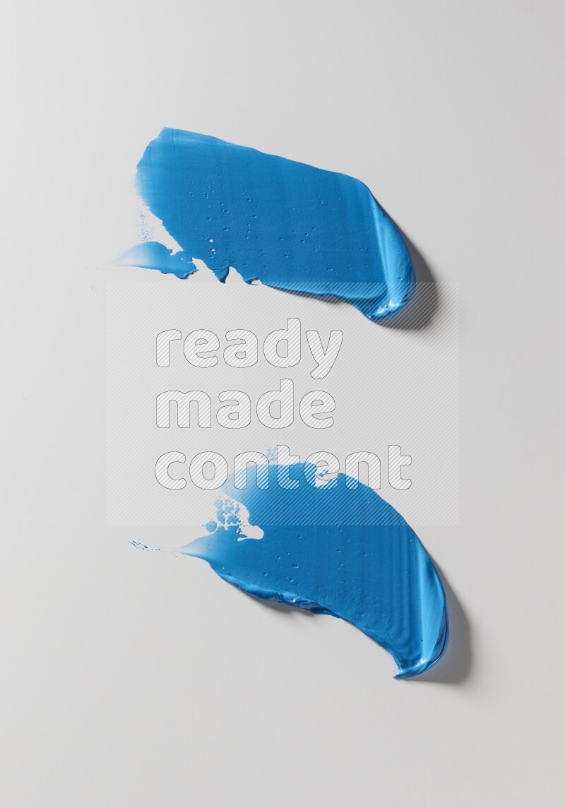 Blue painting knife strokes on white background