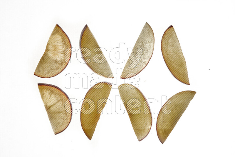 Plum slices on illuminated white background