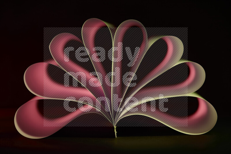 An abstract art piece displaying smooth curves in yellow and red gradients created by colored light