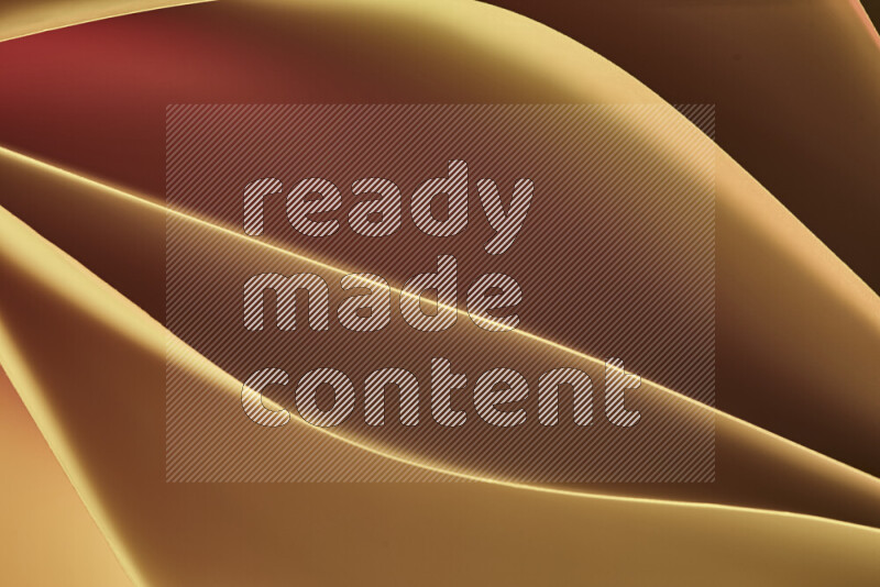 هذه الصورة تعرض تكوين فن الورق التجريدي مع منحنيات ورقية بتدرجات اللون الأصفر والأحمر والبني المكونه بواسطة الضوء الملون