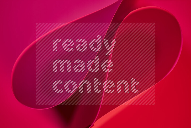 An abstract art of paper folded into smooth curves in red gradients