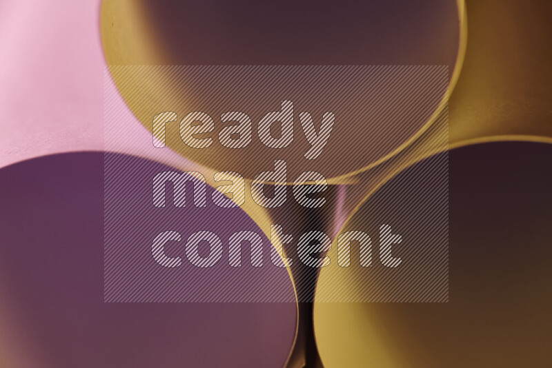 The image shows an abstract paper art with circular shapes in varying shades of pink and warm tones