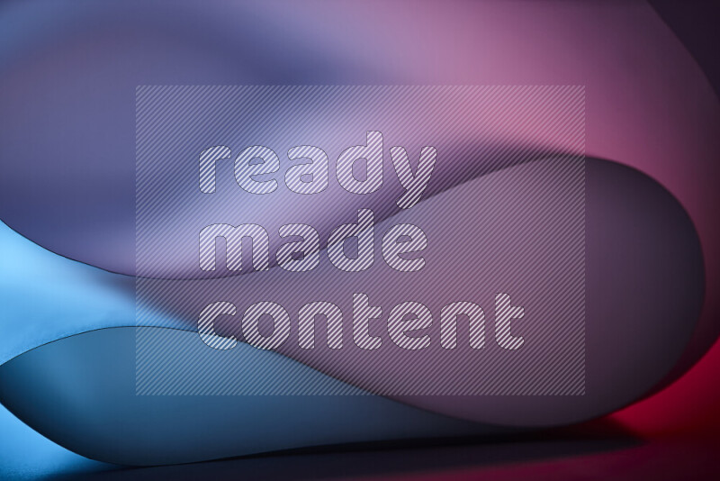 An abstract art piece displaying smooth curves in blue and red gradients created by colored light