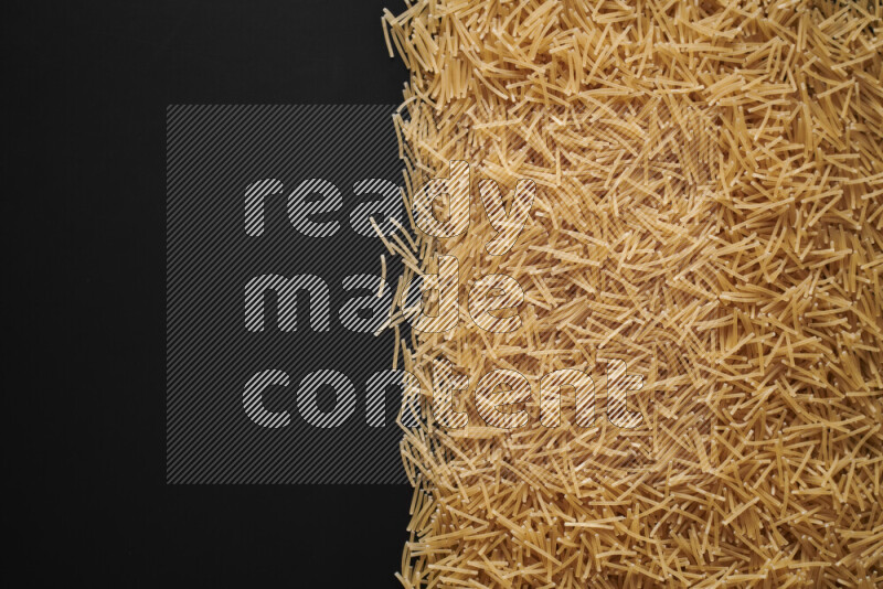 Different pasta types on black background