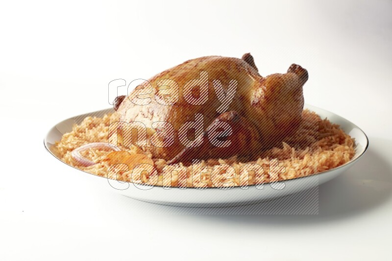 red basmati Rice with whole roasted chicken on a white plate with a silver rim direct on white background