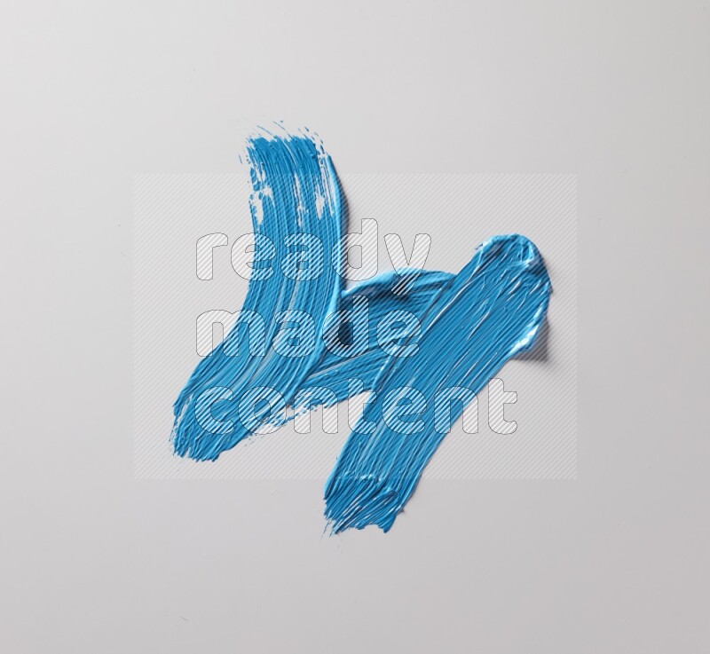 Multi blue curved brush strokes shaped into different shapes on a white background