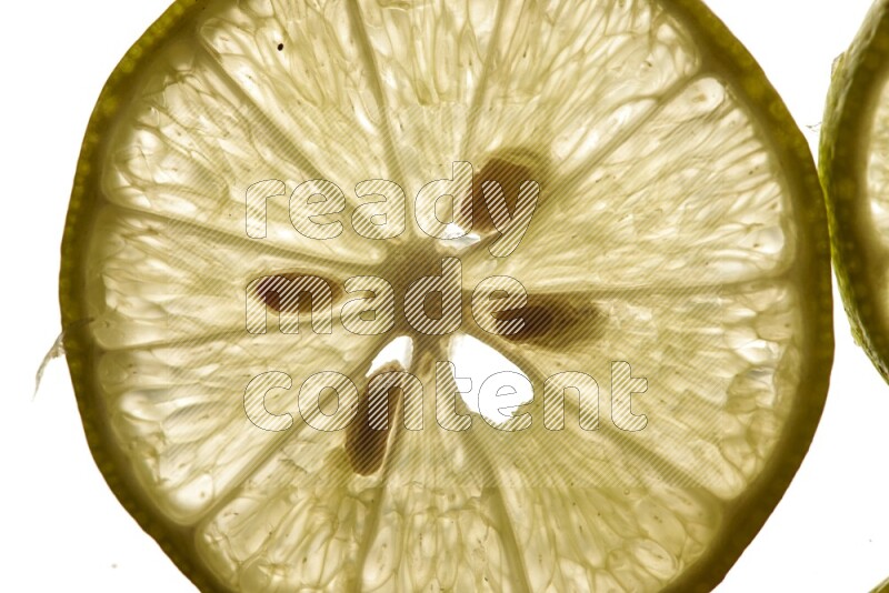 Lemon slices on illuminated white background