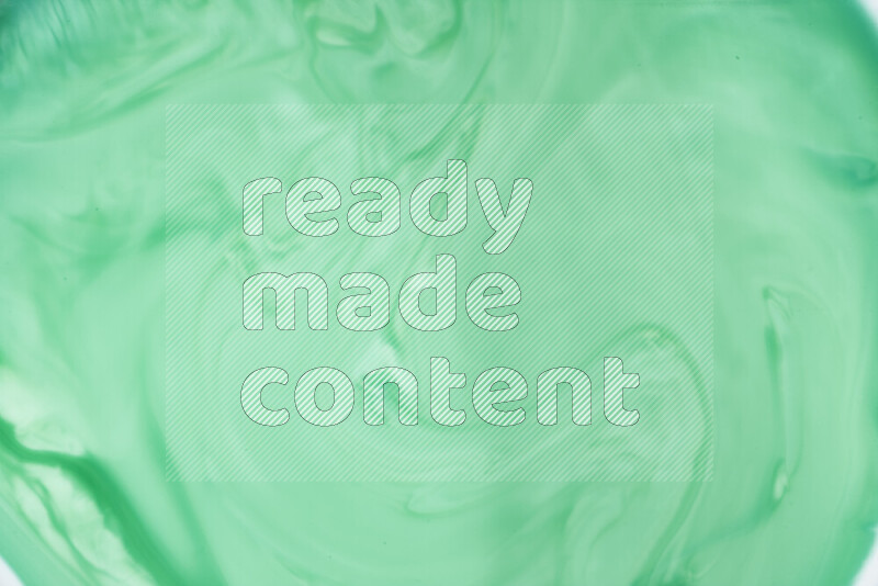 A close-up of abstract swirling patterns in green gradients