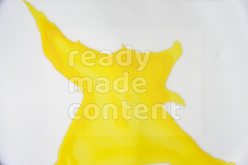 A close-up of abstract swirling patterns in yellow and white