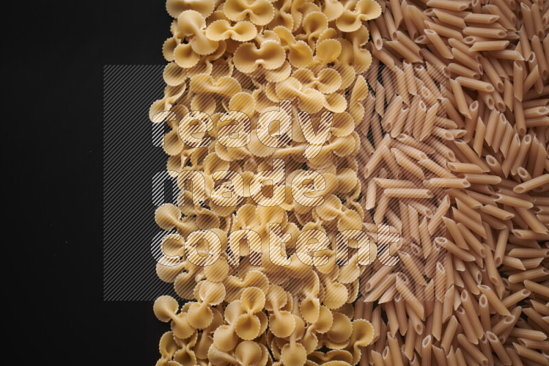 Different pasta types on black background