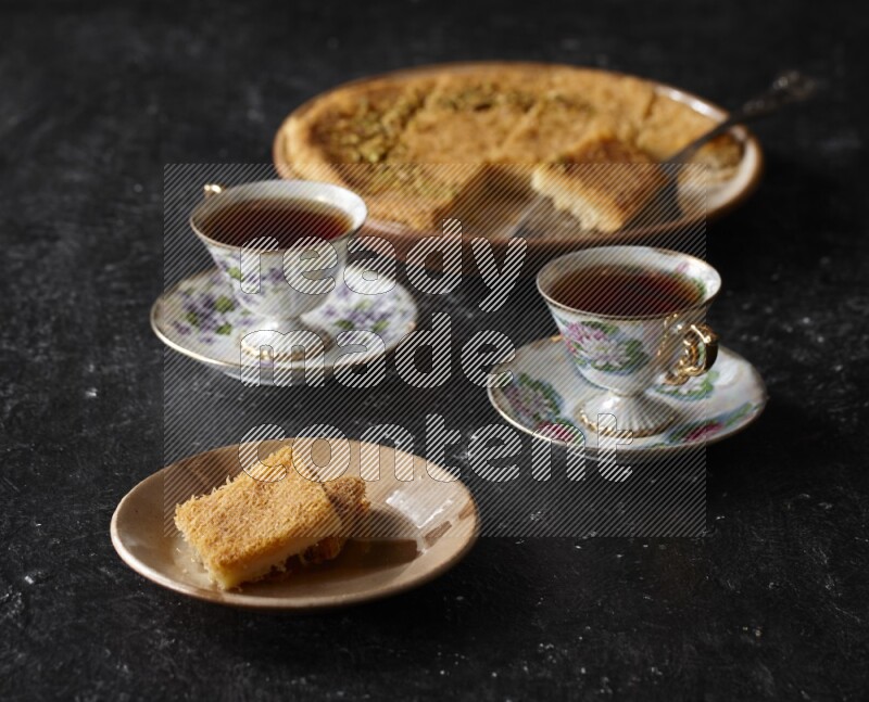 konafa with tea in a dark setup