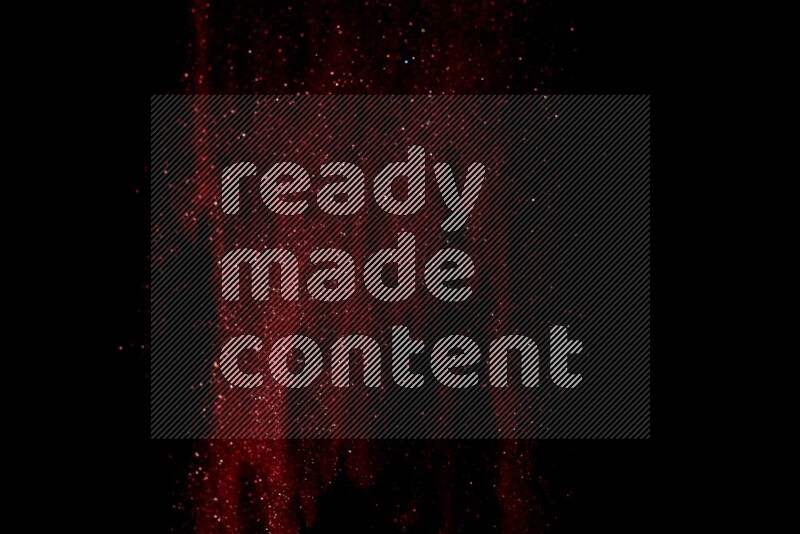 Red glitter powder isolated on black background