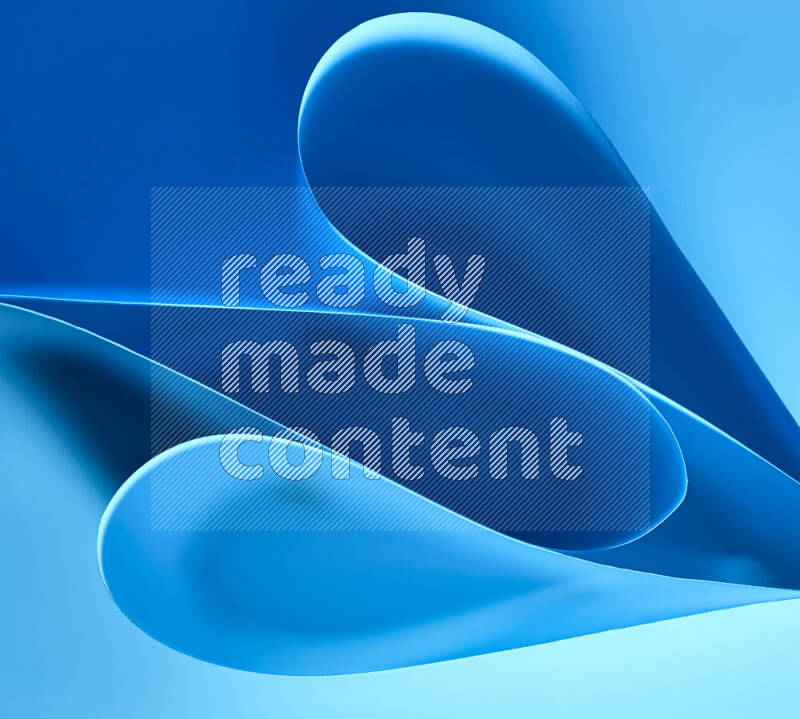 An abstract art of paper folded into smooth curves in blue gradients