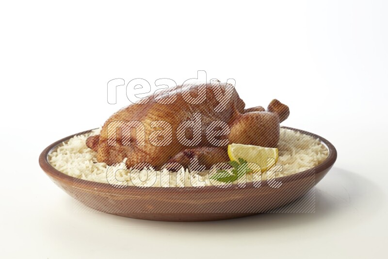 white  basmati Rice with  whole roasted chicken    on a pottery plate  direct  on white background