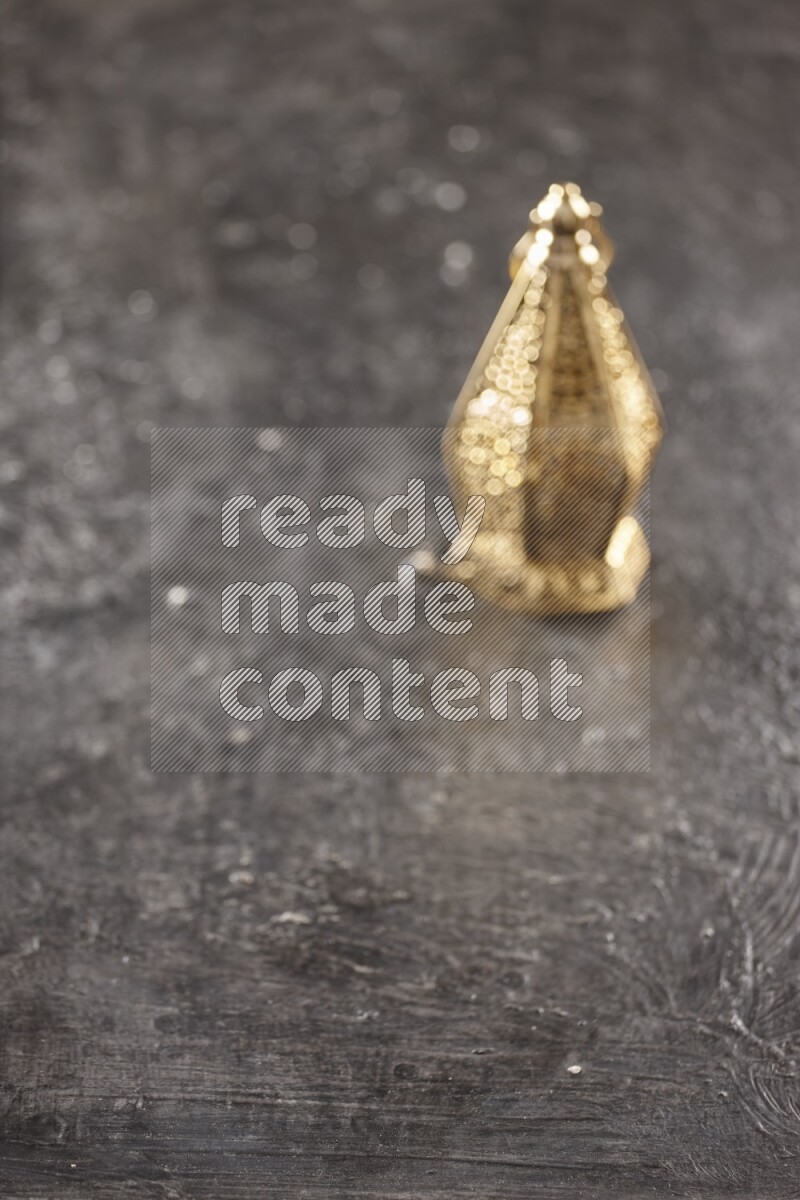 An out of focus lantern on textured black background