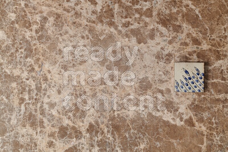 A decorative coaster on beige marble background