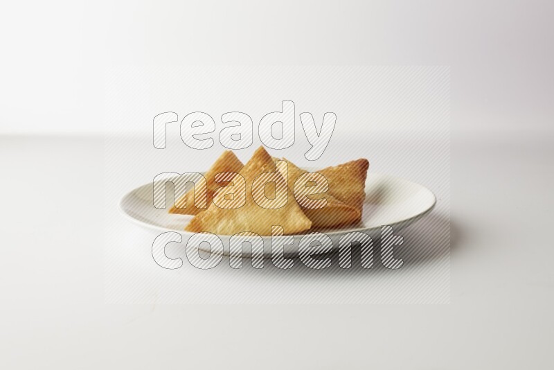 sambosas on a white background