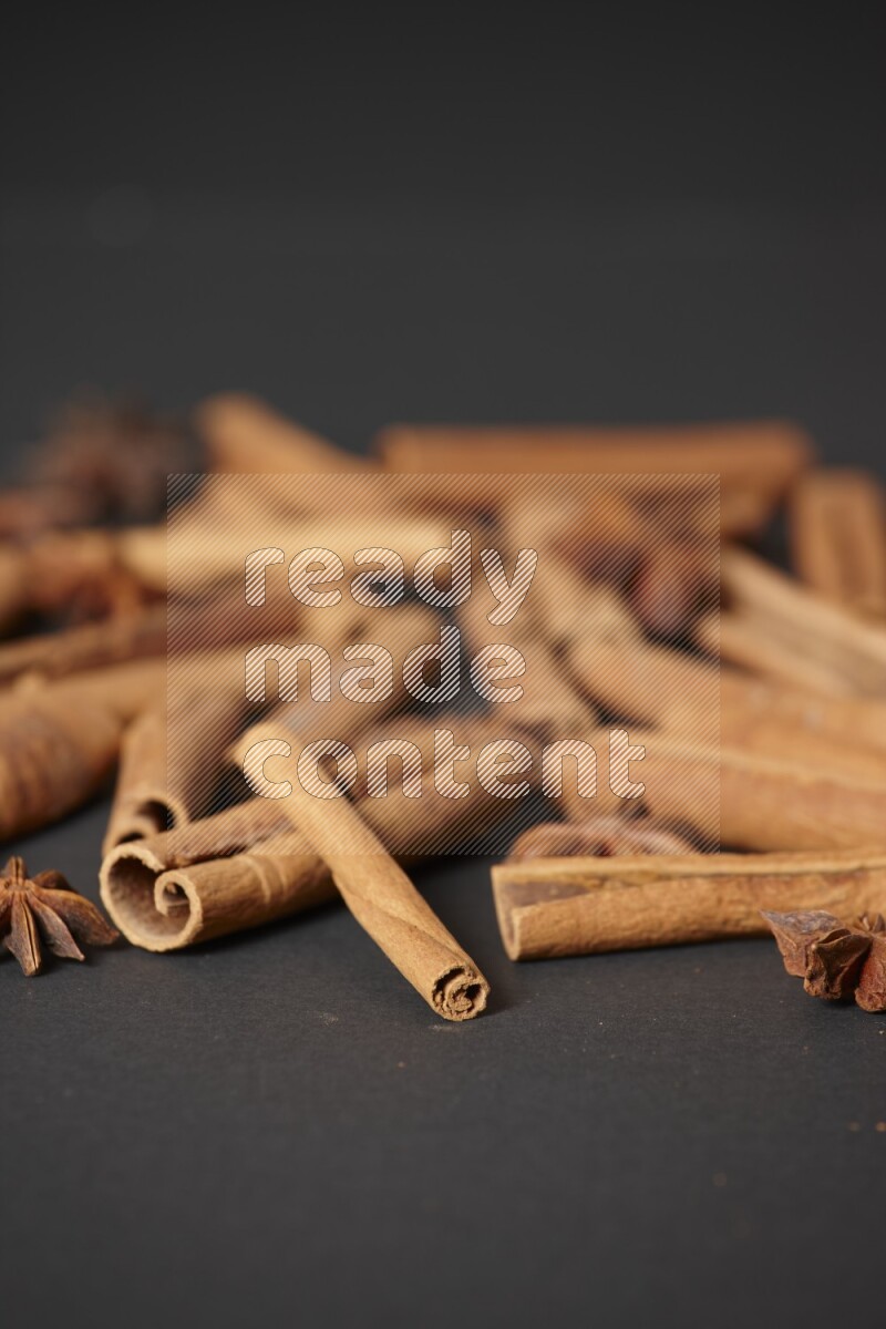 Cinnamon sticks and star anise on black background
