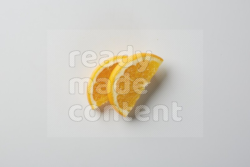 Two halves of an orange slices on white background