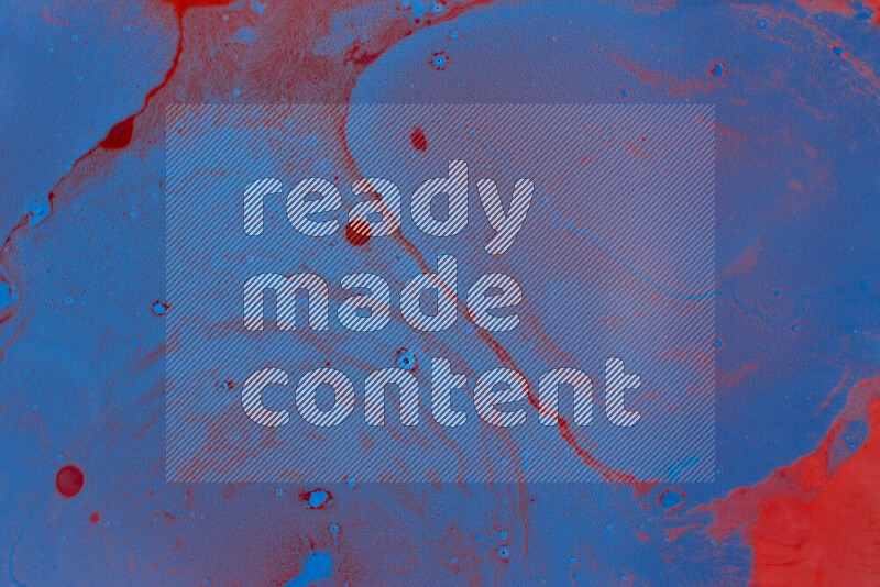 The image depicts a marbling effect with swirling patterns of red and blue