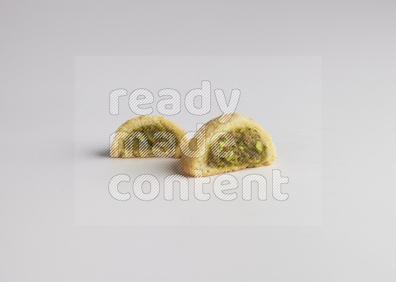 Half Maamoul filled with pistachio direct on white background