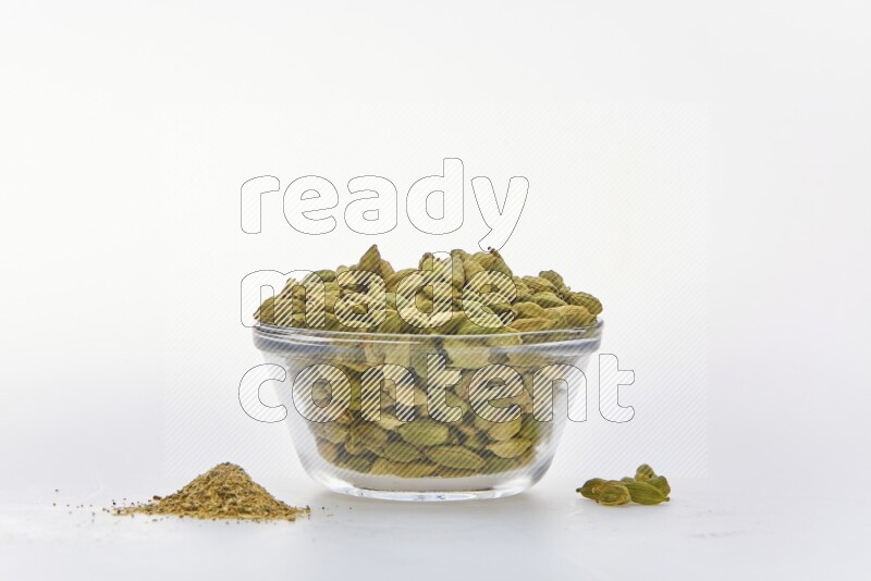 Cardamon in a container on white background