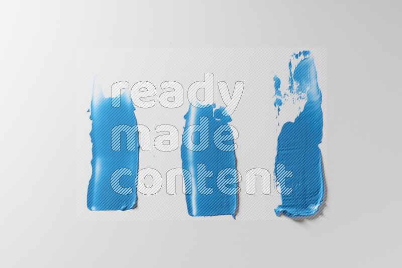 Blue painting knife strokes on a white background