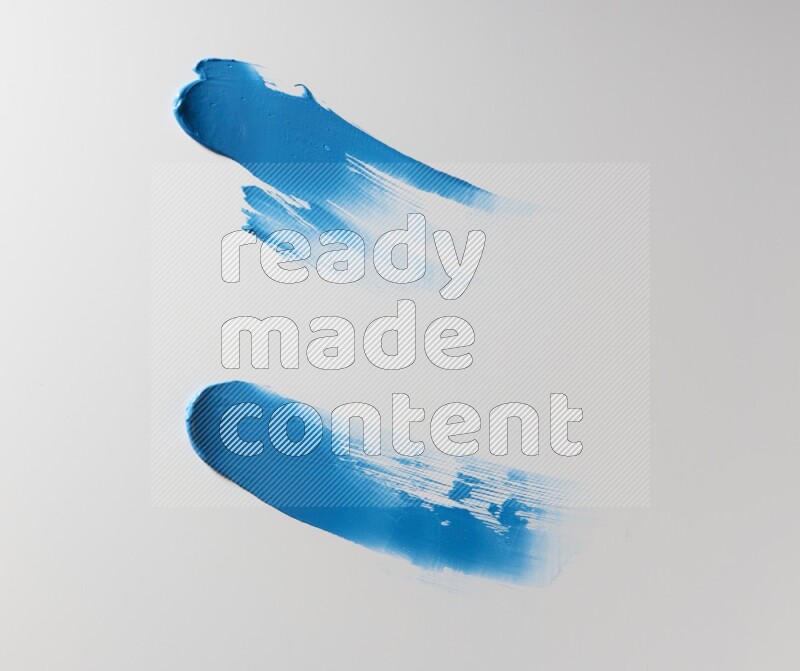 Blue curved painting knife strokes on white background