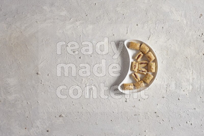 Oriental sweets in a pottery plate in a light setup