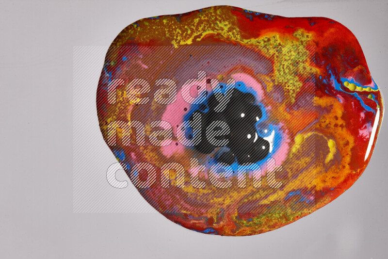 Close-ups of assorted colors blending on a grey background