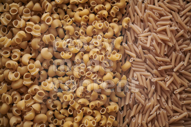 Different pasta types on black background