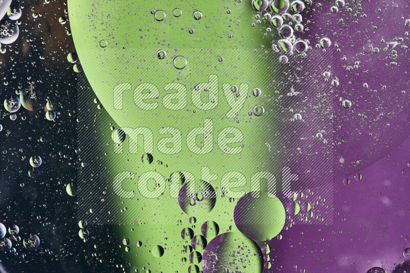 Close-ups of abstract oil bubbles on water surface in shades of black, green and purple