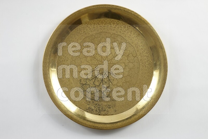 A golden metal tray on white background