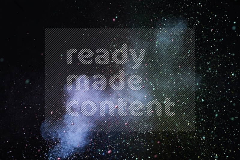 Colorful powder explosion on black background